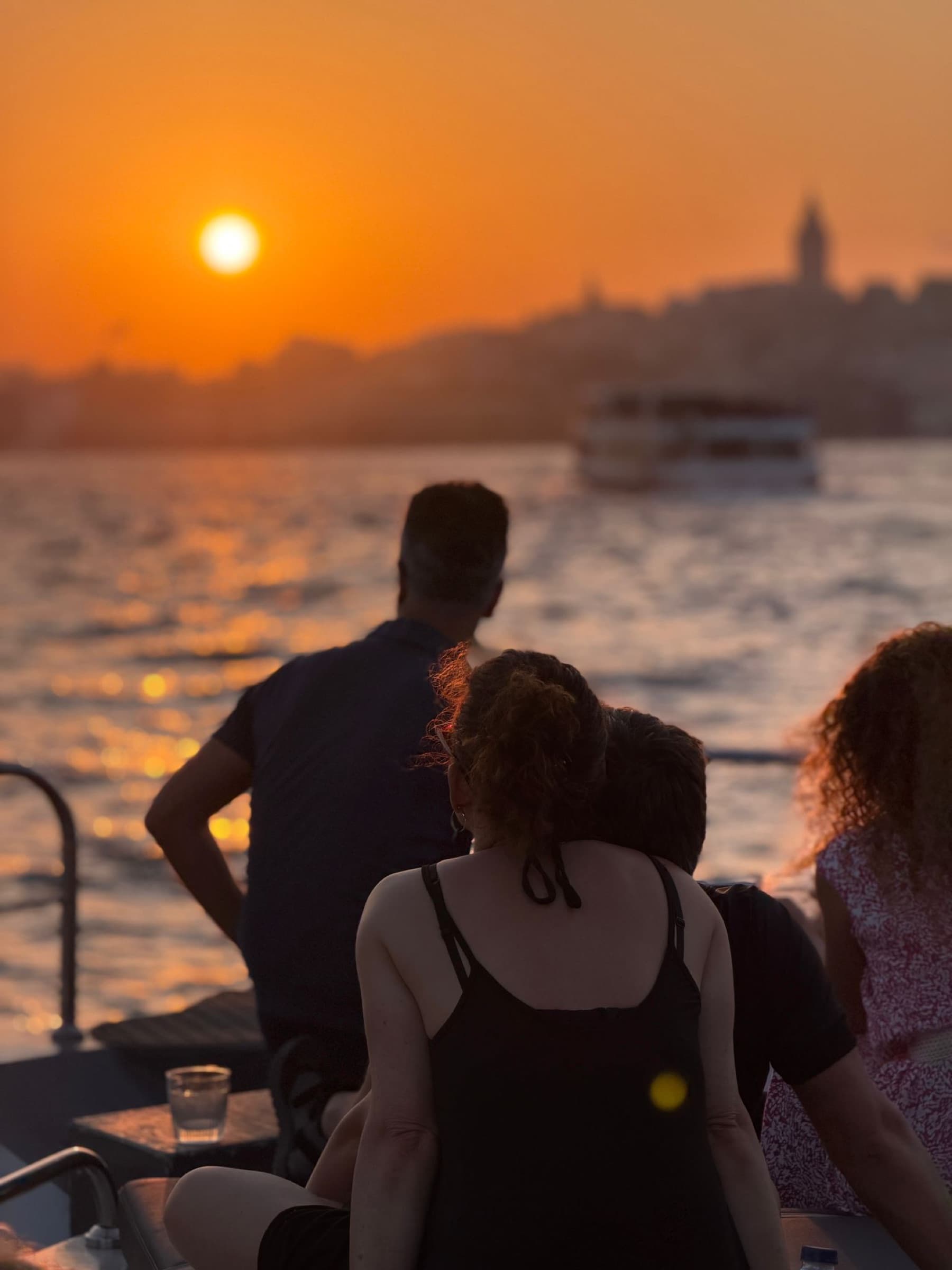 Couple watching the sunset over Galata from the deck