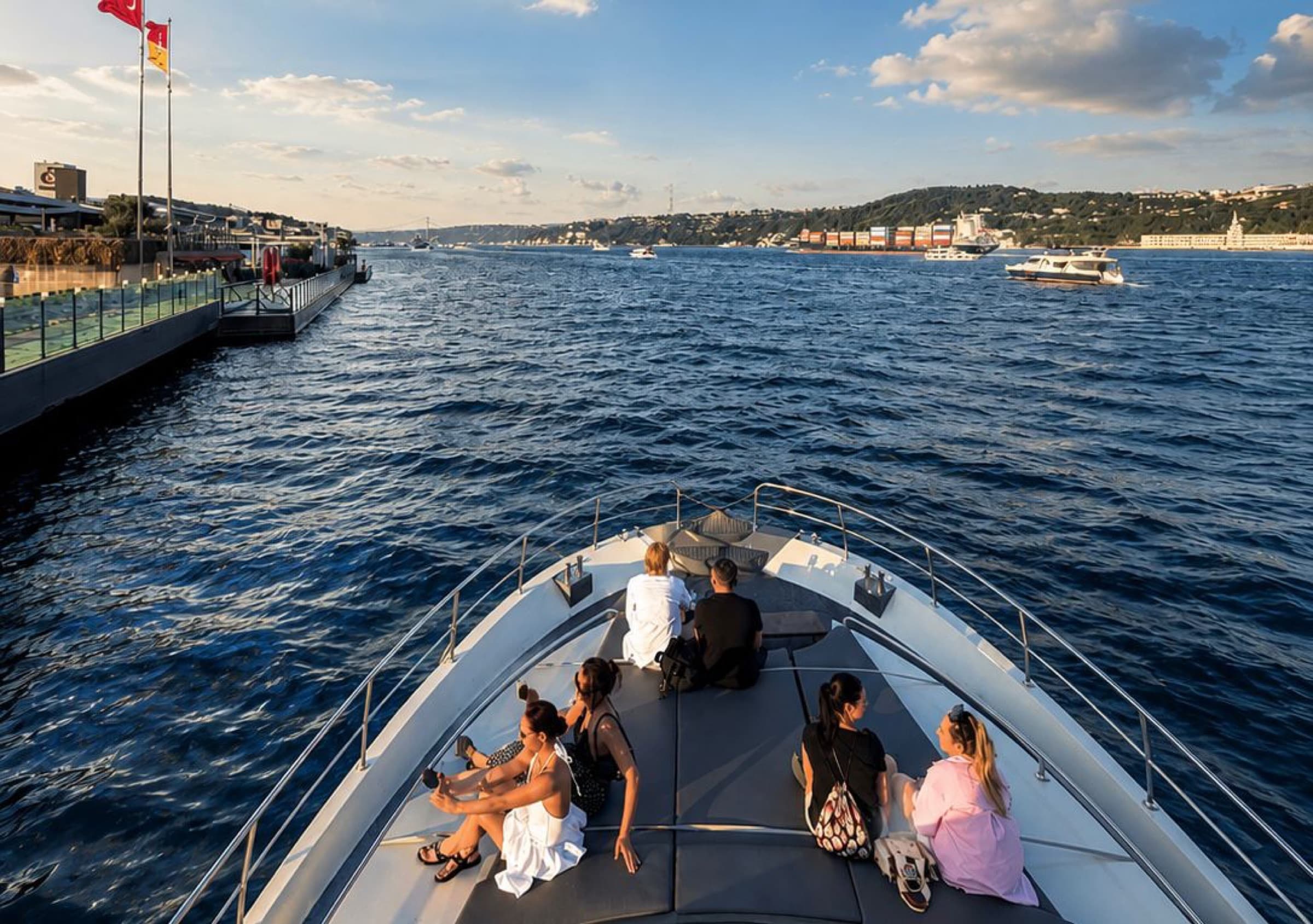 Private group cruising past the Bosphorus shore on a clear day