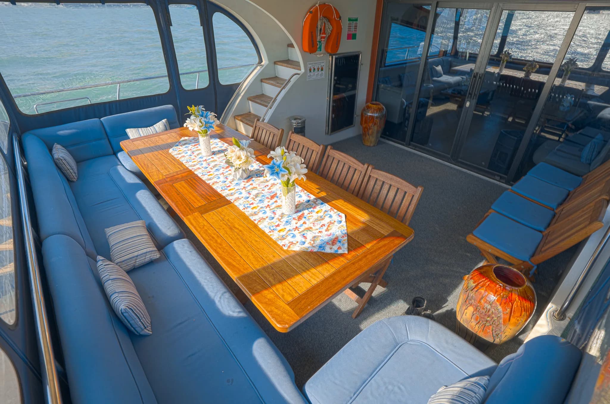 Dining table set for guests on the yacht, sea view