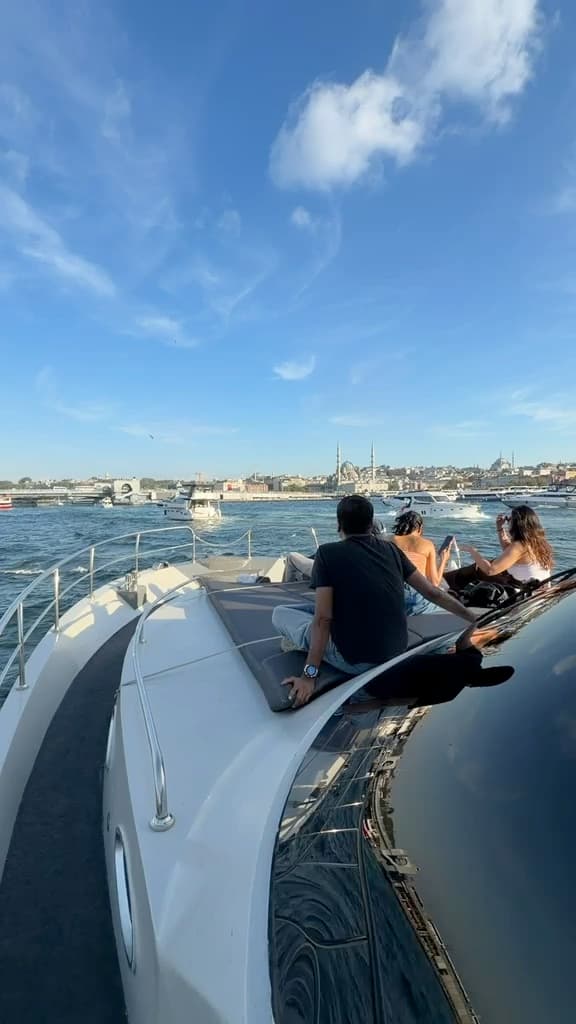 Guests on the foredeck cruising the Bosphorus on a clear afternoon